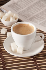 cup of coffee, sugar and newspaper closeup 