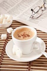 cup of coffee, sugar and newspaper closeup 