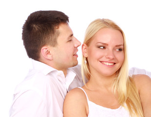 Happy couple in love on white. Man whisper a compliment