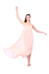 Fototapeta na wymiar graceful girl in flying light pink dress, isolated on a white