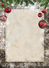 Christmas theme with blank paper on wooden planks