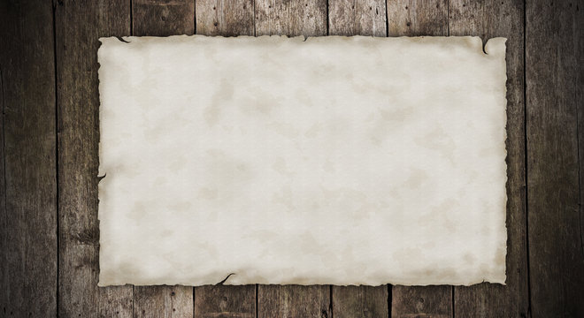 Blank old paper on wooden planks