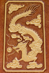 sculpture of the dragon on concrete plate