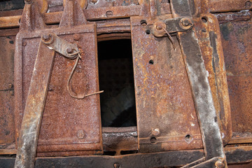 The door of the old rusty locomotive boiler