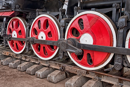 Old steam locomotive engine wheel and rods details