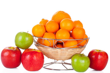 bucket of red and green apples and oranges