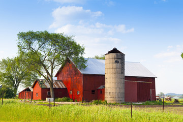 Traditional American Red Barn With Blue Sky