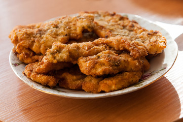 The dish full  of meat - the pork crunchy chops