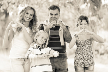 Happy Family with Heart Shaped Hands