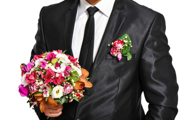 Red wedding bouquet in man's hand
