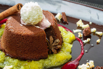 Chocolate muffin with liquid chocolate in the middle and fruit m
