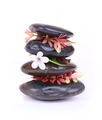 spa stones with white flower isolated on white