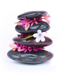 spa stones with white and hot pink flowers isolated on white - 46173812