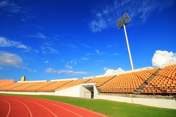 run race in stadium against  blue sky