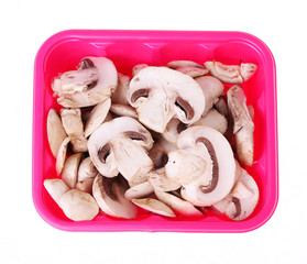 sliced mushrooms in box isolated on white