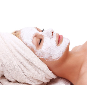beautiful girl with spa mask on face isolated