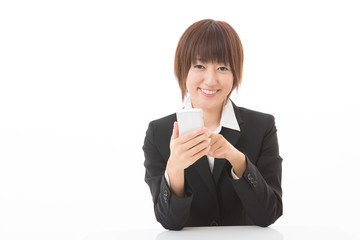 スマートフォンを見る女性　ビジネス