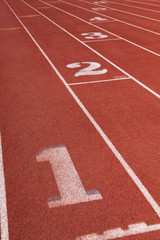 Lanes on a athletic running track with the number 1
