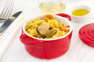 rice with seafood in red bowl