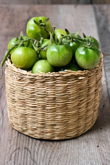 Green tomatoes in the basket