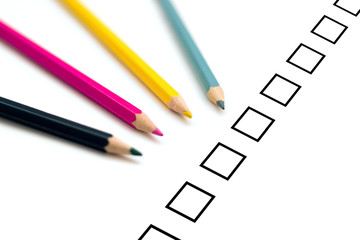 Set of four colorful crayons filling survey