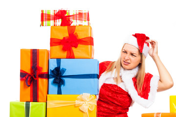 Worried female Christmas Santa with many gifts