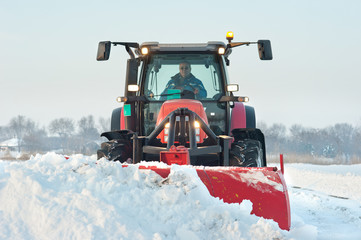 Fototapeta premium Tractor cleaning snow