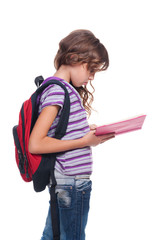 serious schoolgirl reading book