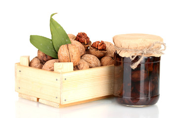 jam-jar of walnuts and a wooden box with walnuts