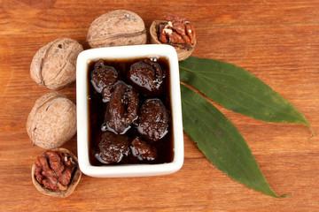 jam of walnutsjam walnuts in a bowl  on wooden table