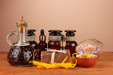 ingredients for soap making on brown background