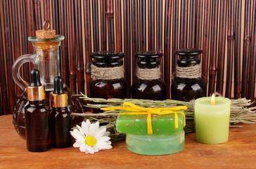 ingredients for soap making on brown background
