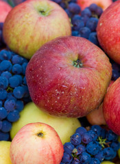 a lot of apples and grapes