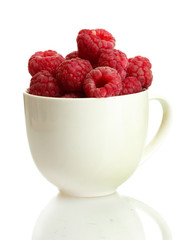 ripe raspberries in cup isolated on white