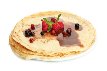 Delicious pancakes with berries and chocolate