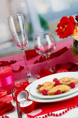 Table setting in honor of Valentine's Day on room background
