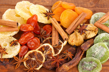 Dried fruits with cinnamon and anise stars close-up