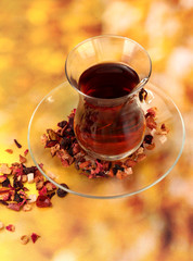 glass of Turkish tea on color background