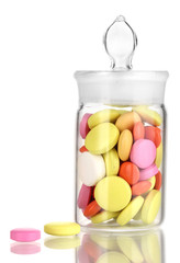 Pills in receptacle isolated on white