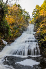 beautiful waterfall in forest, autumn landscape