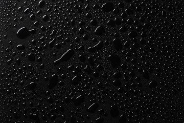 Water drops on black surface