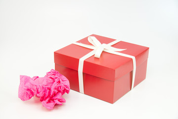 Red gift box with white ribbon and bow