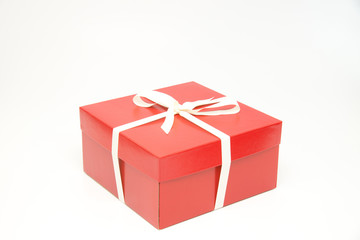 Red gift box with white ribbon and bow