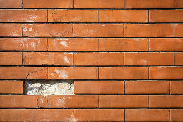 Brick wall with missing brick