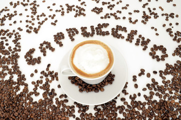 Word cappuccino and  a cup of coffee