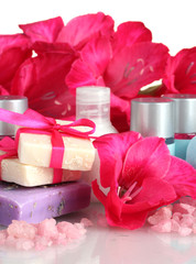 cosmetic bottles, soap and flowers