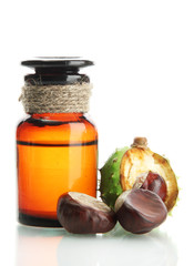 medicine bottle with chestnuts and leaves, isolated on white