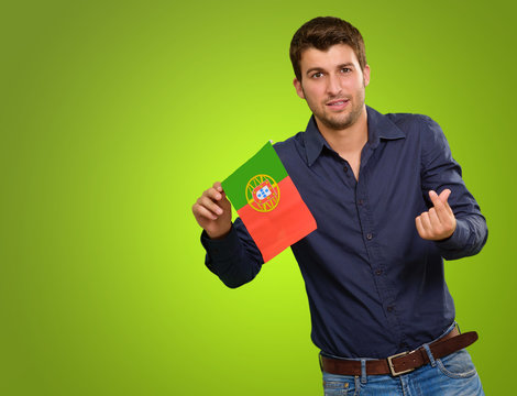 Man Holding A Miniature Airplane And Portugal Flag