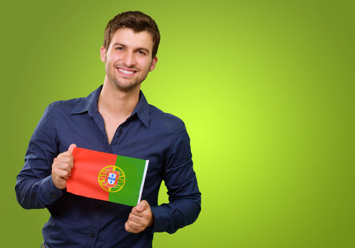 Man Holding A Miniature Airplane And Portugal Flag