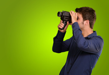 Fototapeta premium Young Man Holding Old Camera